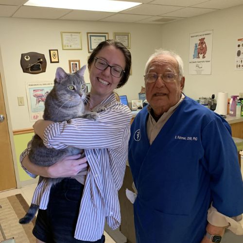 Dr. Rahman with a woman and her cat